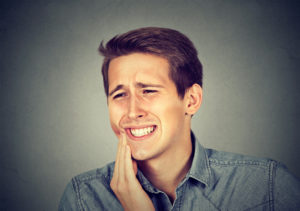 Man with pain in his jaw