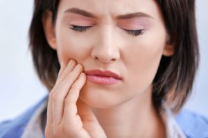 Woman with jaw pain