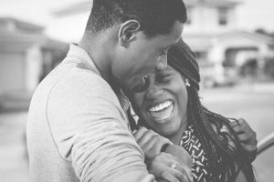 Couple hugging and smiling